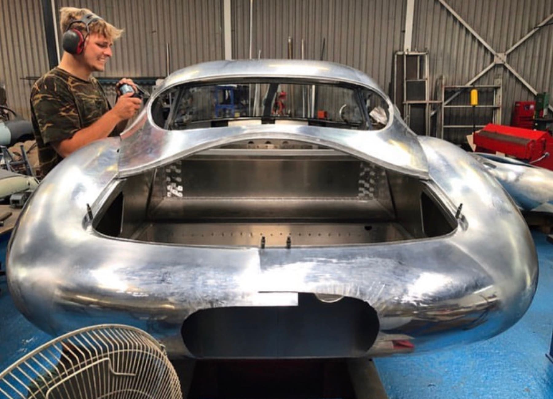 Finishing a hand-formed aluminium coachbuilt body shell in the workshop