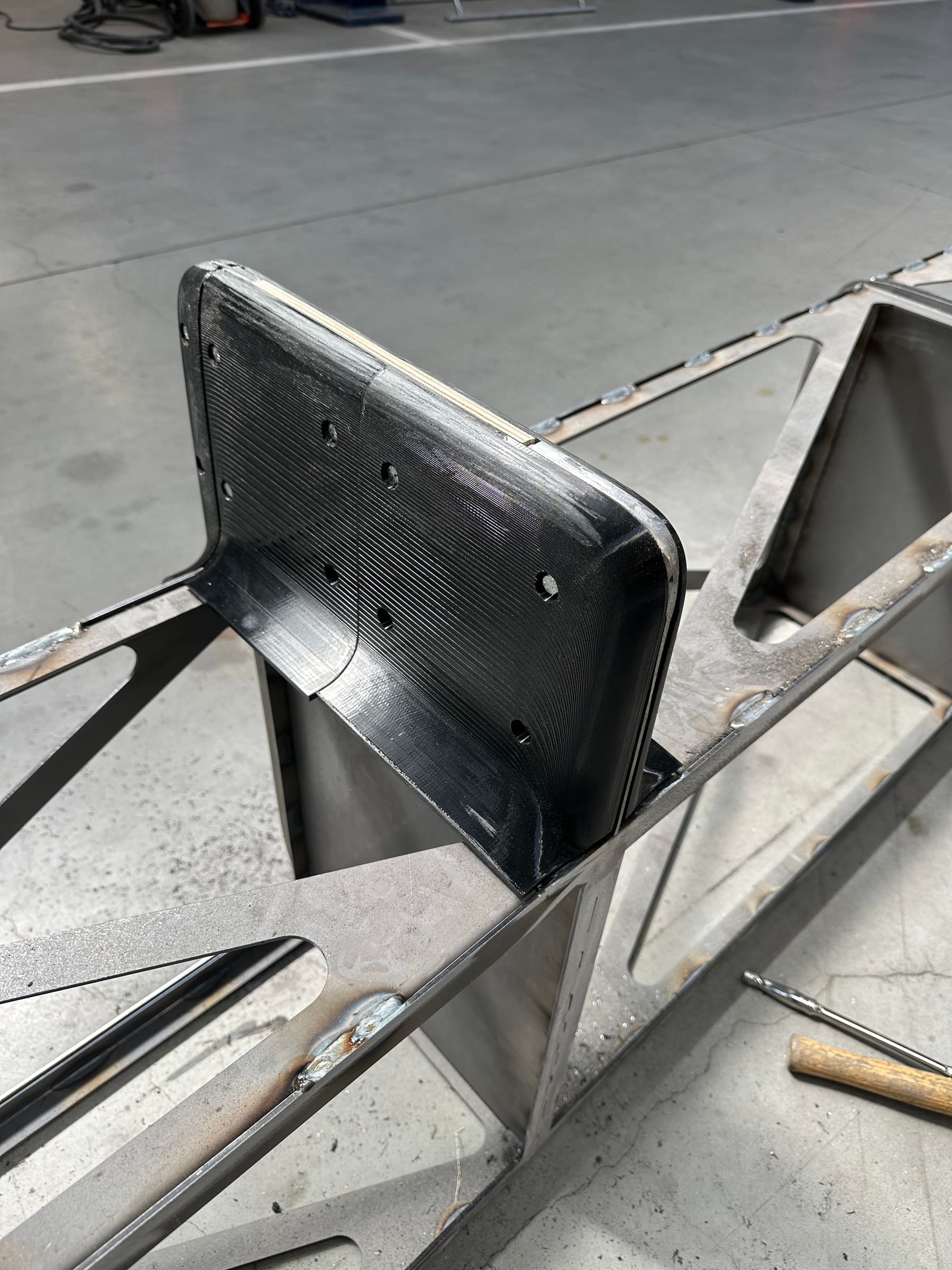 The real welded lattice-frame chassis bracket, built from the CAD model