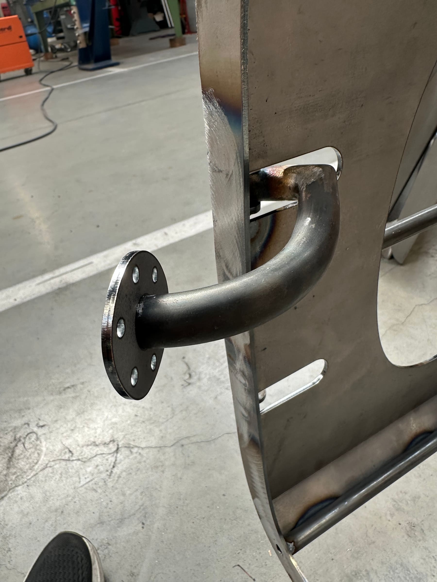 Welded tube bracket detail on the lattice-frame chassis