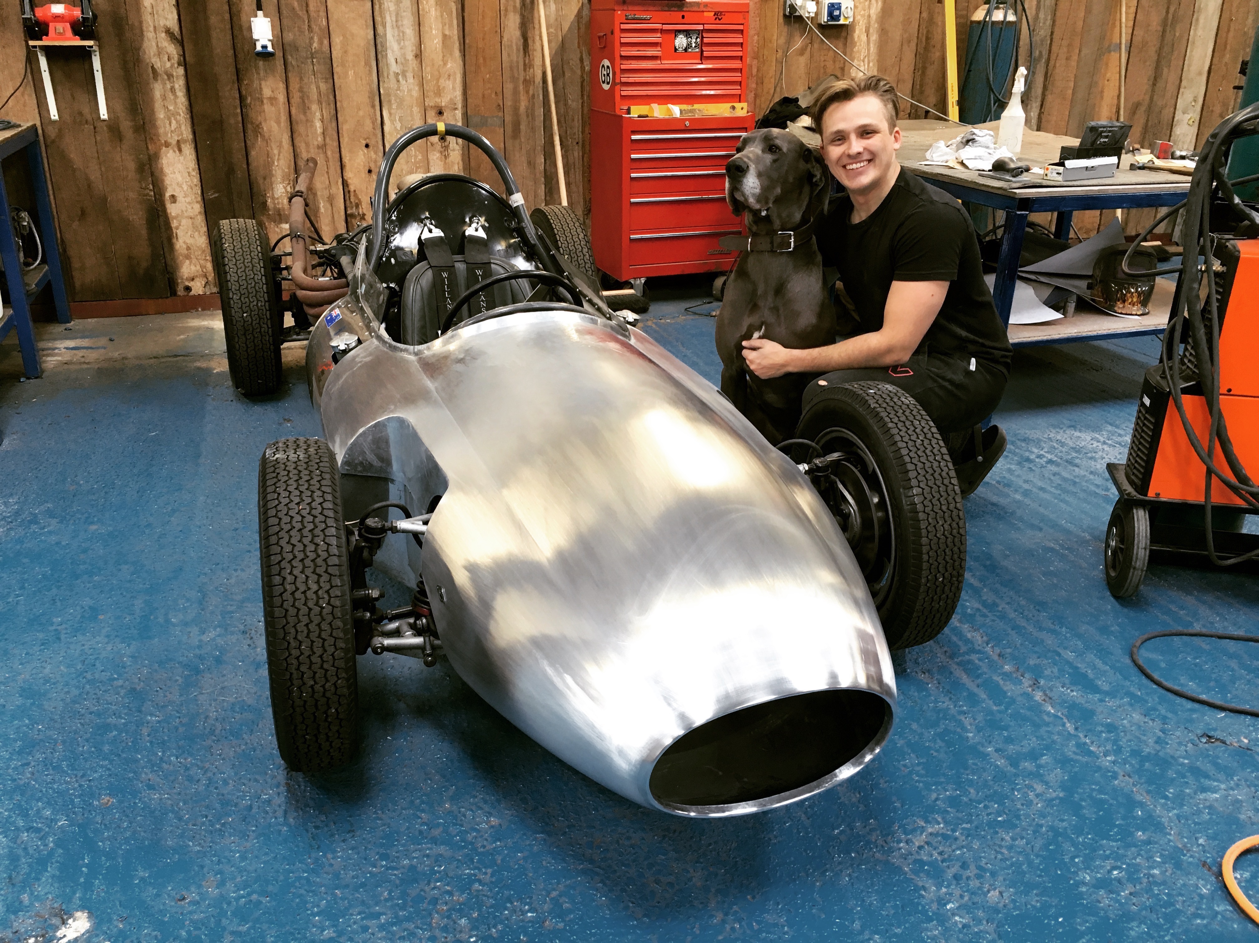 Toby Southan with a hand-formed aluminium body in the workshop